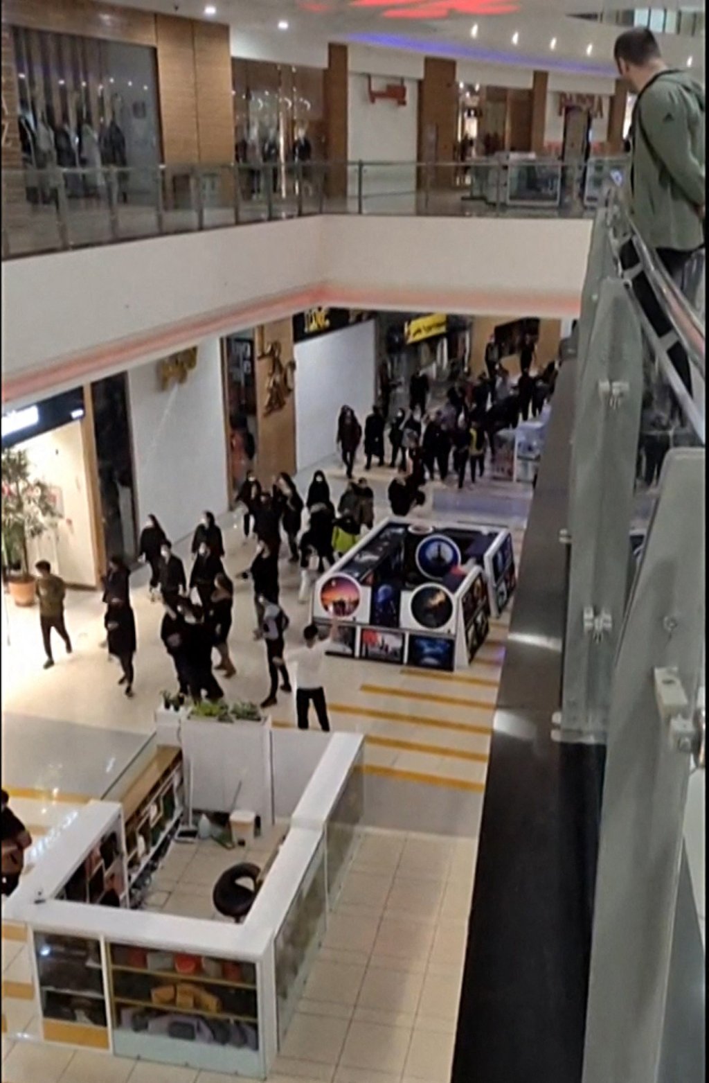 Image grab from a UGC video reportedly shows Iranian demonstrators walking through a shopping centre and shouting slogans in support of the protest movement in the heart of Iran’s central city of Isfahan on Tuesday. Photo: UGC / AFP