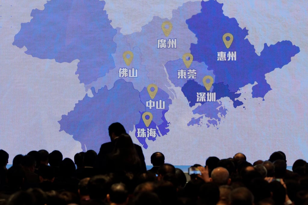 A screen shows a map of Greater Bay Area during a symposium on the development of the area, which links Hong Kong, Macao and nine other cities, in February 2019. Photo: AP