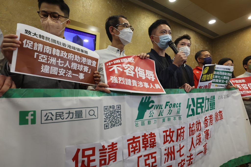 Lawmaker Dominic Lee (with microphone) protests with others outside the South Korean consulate in Hong Kong. Photo: Edmond So Lawmaker Dominic Lee (with microphone) protests with others outside the South Korean consulate in Hong Kong. Photo: Edmond So