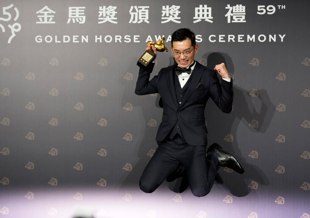 Malaysian director Lau Kok-rui with his awards for best new director and best original screenplay at the Golden Horse Awards in Taipei, Taiwan on Saturday. Photo: AP