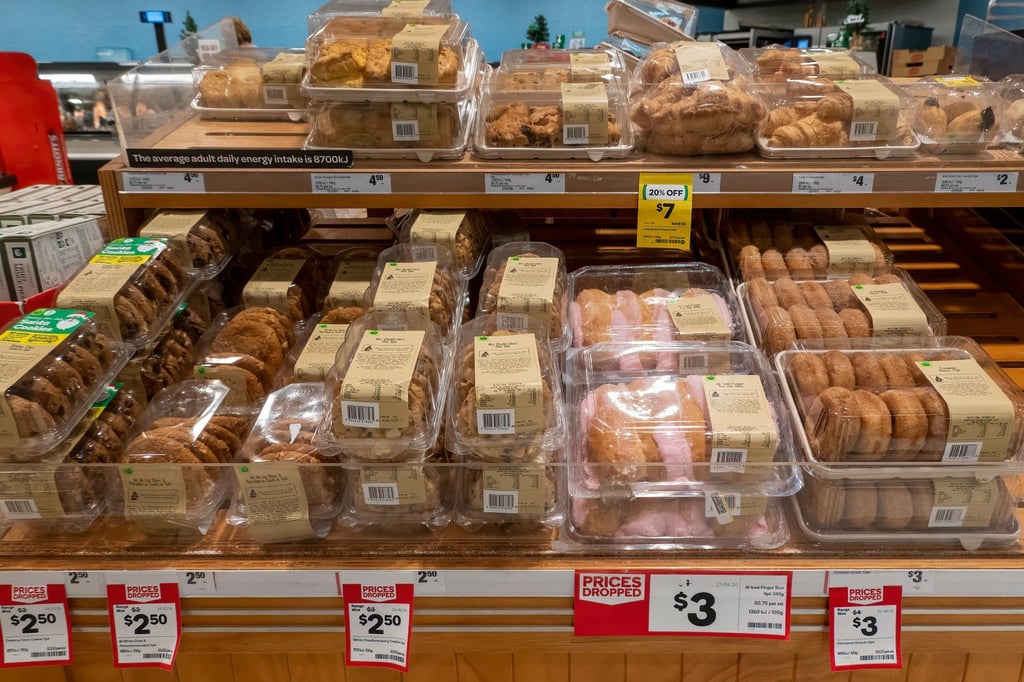 Biscuits, buns and doughnuts for sale at reduced prices on supermarket shelves. Eating too much ultra-processed food could shorten your life, research suggests. Photo: Shutterstock