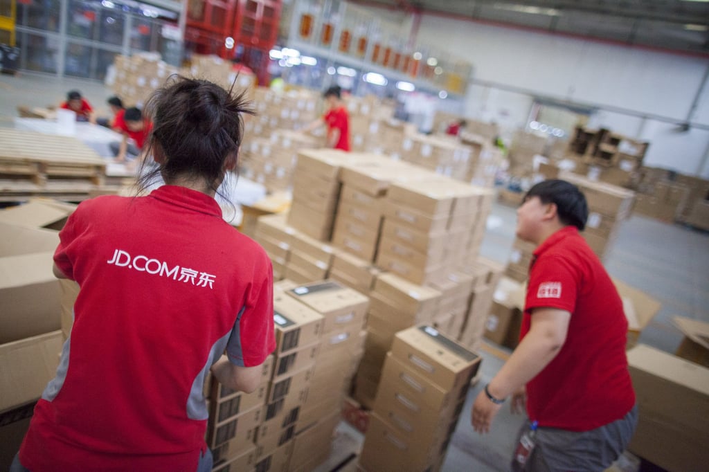 JD.com employees are seen sorting products at one of the company’s warehouse and distribution facilities in mainland China. Photo: Shutterstock