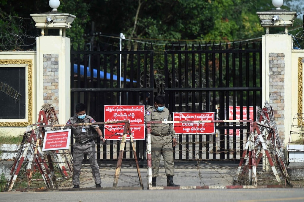 Security officials arrange barbed wire outside a gate of Insein prison in Yangon. Photo: AFP