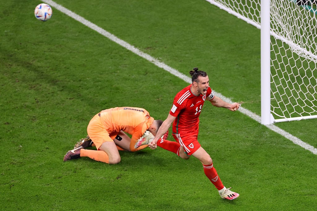 Gareth Bale of Wales celebrates after scoring the team’s first goal via a penalty past Matt Turner of the US. Photo: TNS Gareth Bale of Wales celebrates after scoring the team’s first goal via a penalty past Matt Turner of the US. Photo: TNS