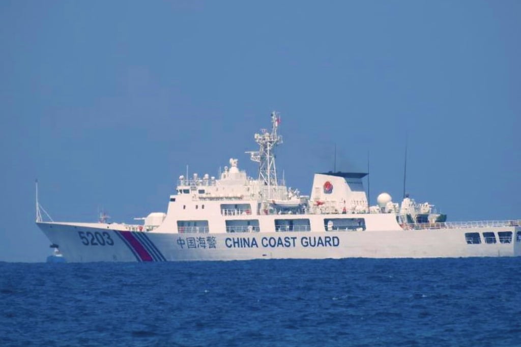 The Philippine navy said a team dispatched form a Chinese coastguard vessel ‘forcefully retrieved’ the rocket debris on Sunday by cutting a towing line attached to a Filipino boat. Photo: Philippine coastguard via AP