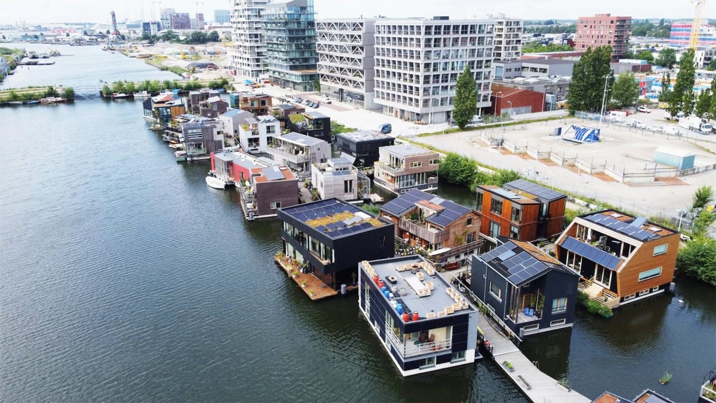 Space&Matter’s community-inspired Schoonschip project in Amsterdam comprises 46 floating eco-homes connected by a jetty. Space&Matter’s community-inspired Schoonschip project in Amsterdam comprises 46 floating eco-homes connected by a jetty.