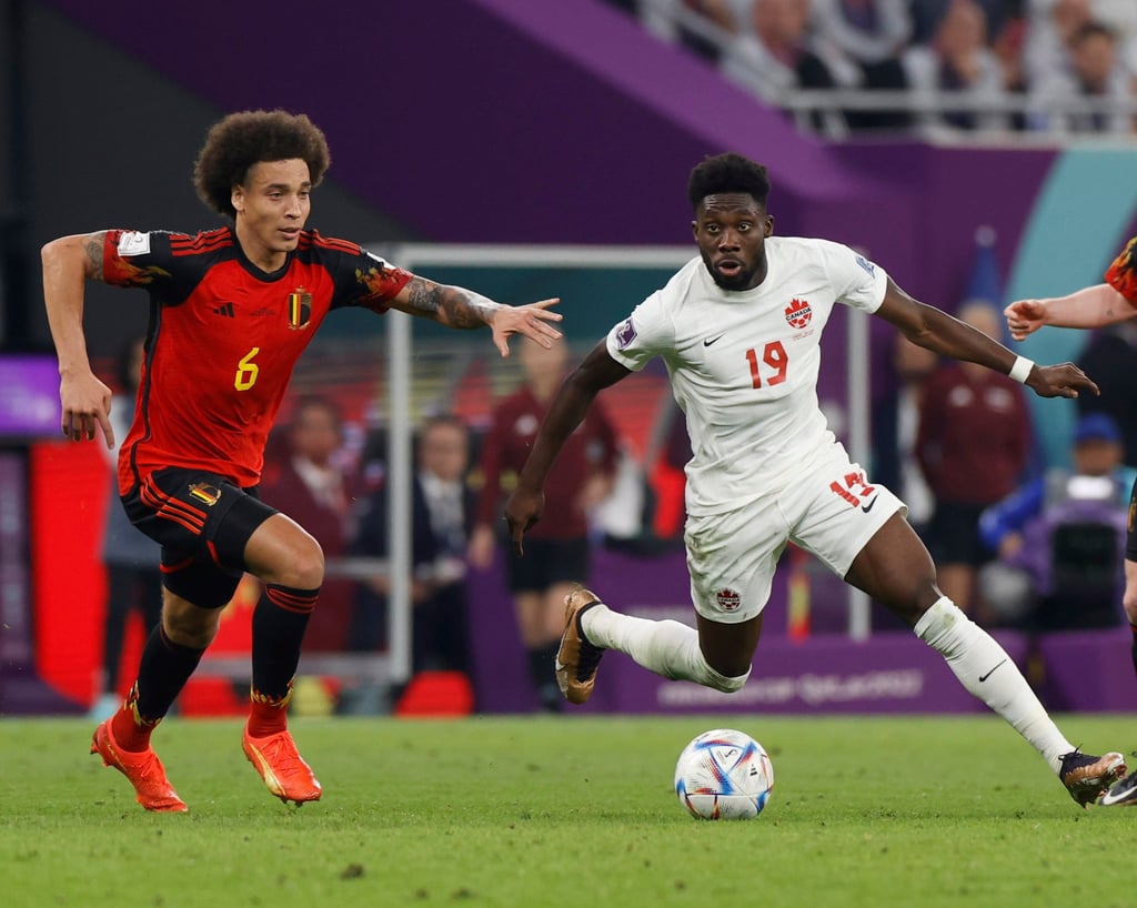 Canada’s Alphonso Davies (right) is seen in action against Belgium’s Axel Witsel during the Fifa World Cup 2022 group F match at Ahmad bin Ali Stadium in Doha, Qatar on Wednesday. Photo: EPA-EFE Canada’s Alphonso Davies (right) is seen in action against Belgium’s Axel Witsel during the Fifa World Cup 2022 group F match at Ahmad bin Ali Stadium in Doha, Qatar on Wednesday. Photo: EPA-EFE