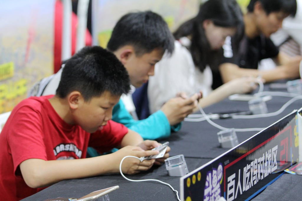 Chinese gamers playing Tencent’s Honor of Kings compete in a tournament. Photo: Imaginechina via AFP