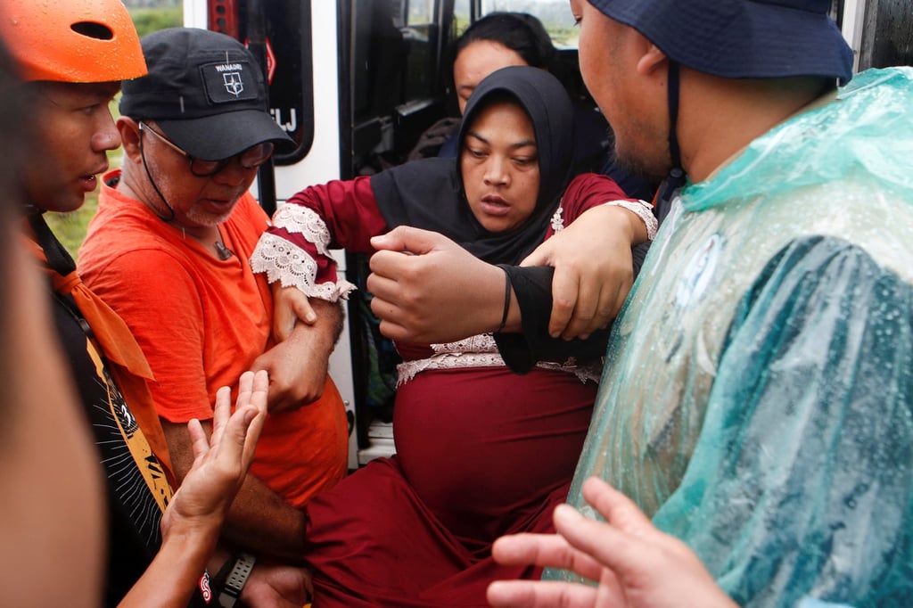 Rohmat Kartini, 35, a pregnant woman, is evacuated to a relief centre after an earthquake hit Sukamulya, in Cianjur, West Java Province, Indonesia on Wednesday. Photo: Reuters