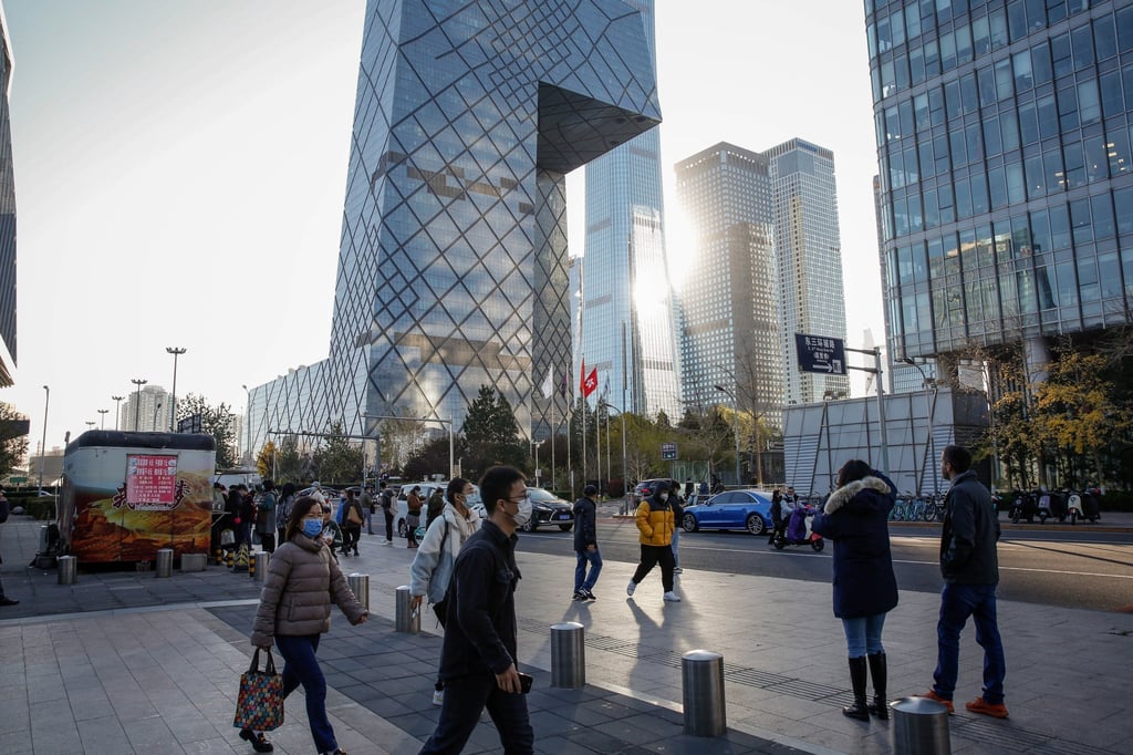 People walk in the central business district of Beijing, China. Photo: EPA-EFE