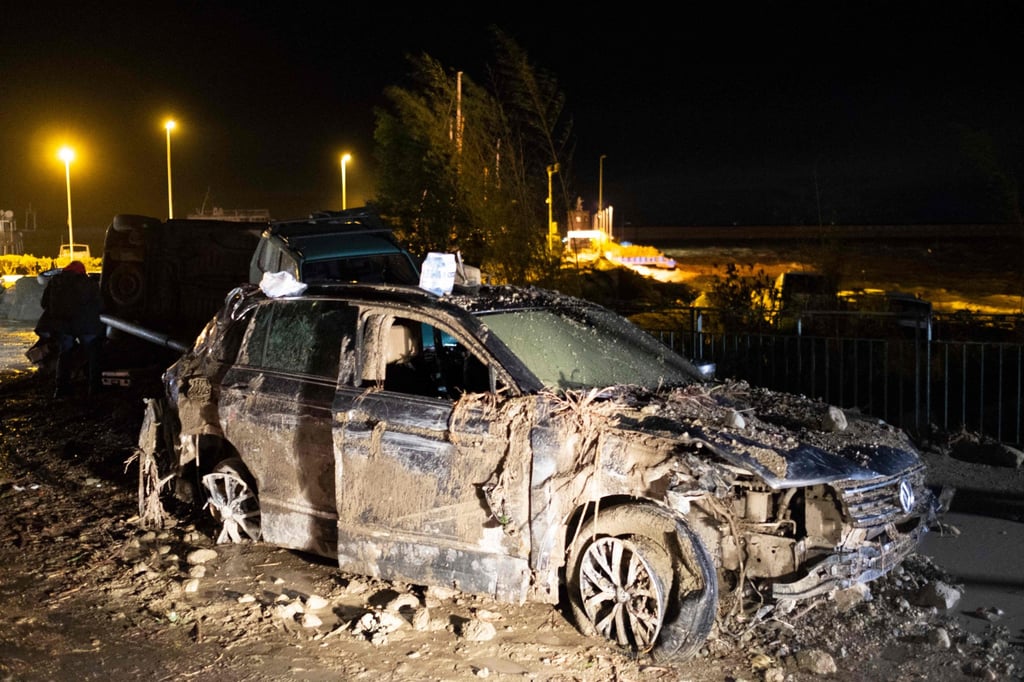 A damaged car following heavy rains that caused a landslide on Italy’s Ischia island on Saturday. Photo: AFP