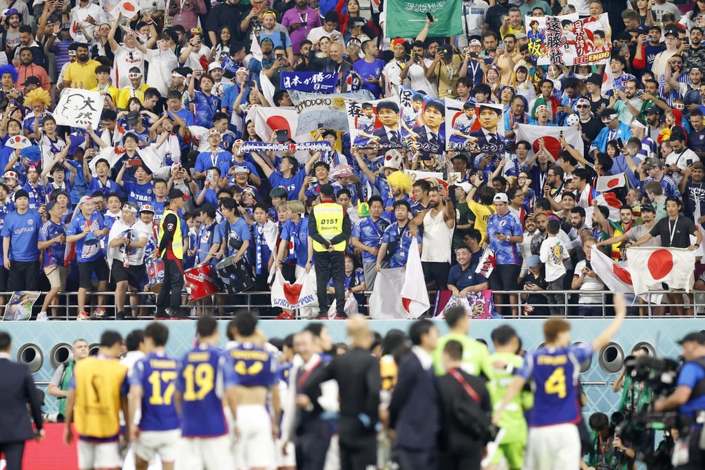 Fans celebrate Japan’s 2-1 victory over Germany in a World Cup Group E football match. Photo: Kyodo