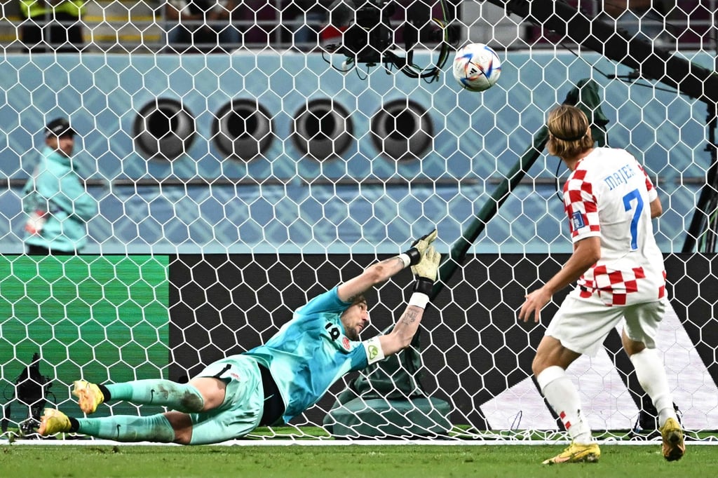 Croatia’s midfielder Lovro Majer scores his team’s fourth goal past Canada’s goalkeeper Milan Borjan during the Qatar 2022 World Cup Group F match in Doha on Sunday. Photo: AFP