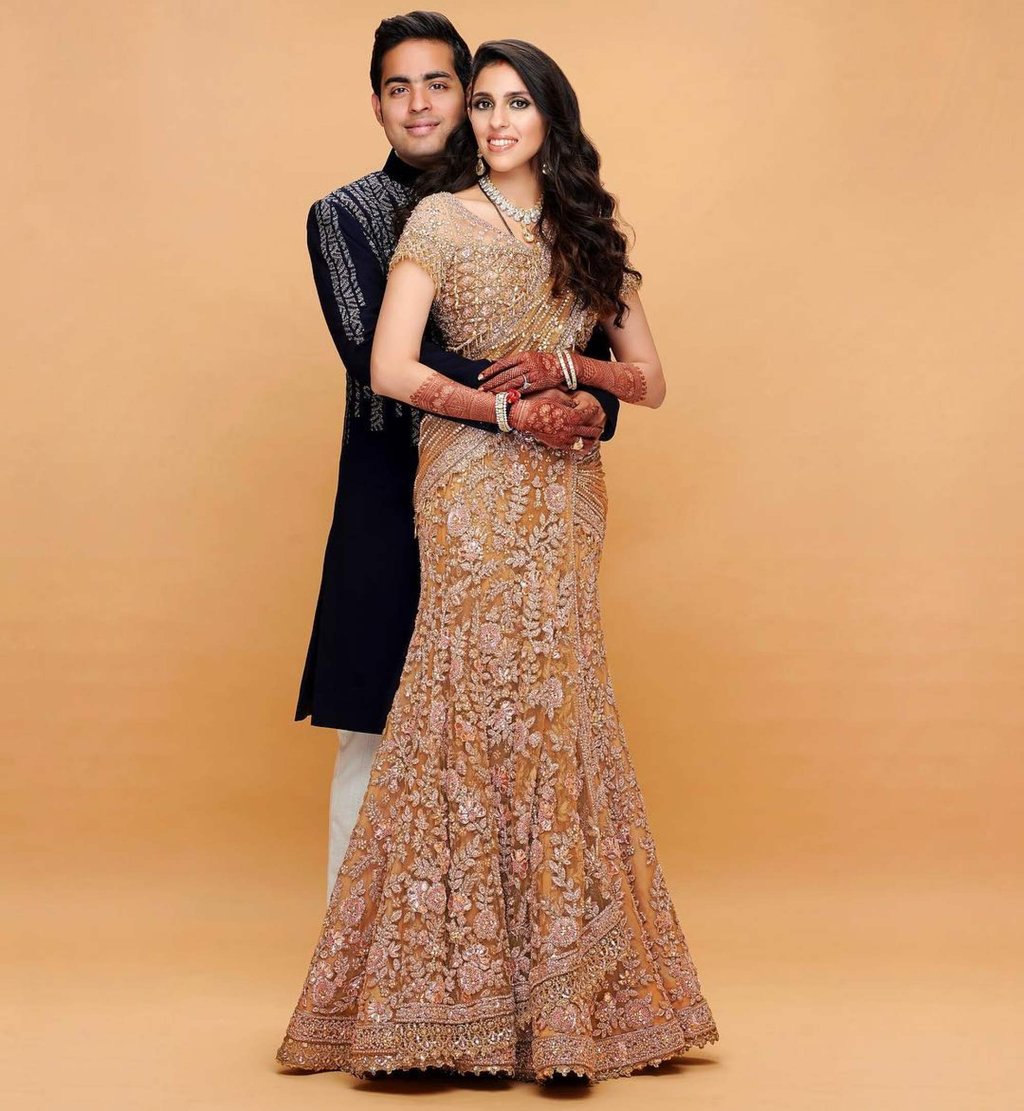 Inside Shloka Mehta s glitzy wardrobe 4 of her best outfits from the colourful Sabyasachi lehenga she wore to Armaan Jain s wedding to her Abu Jani Sandeep Khosla look to marry Akash Ambani