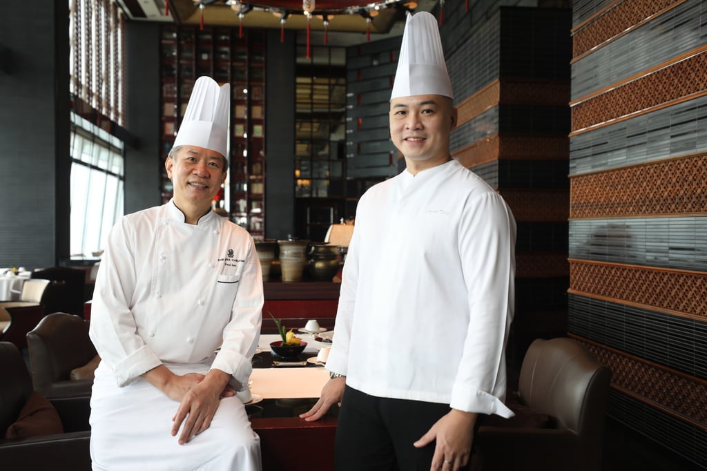 Michelin-starred Chef Paul Lau (left) at Ritz-Carlton Hong Kong’s Tin Lung Heen stands with his former student Tang. Photo: Xiaomei Chen Michelin-starred Chef Paul Lau (left) at Ritz-Carlton Hong Kong’s Tin Lung Heen stands with his former student Tang. Photo: Xiaomei Chen