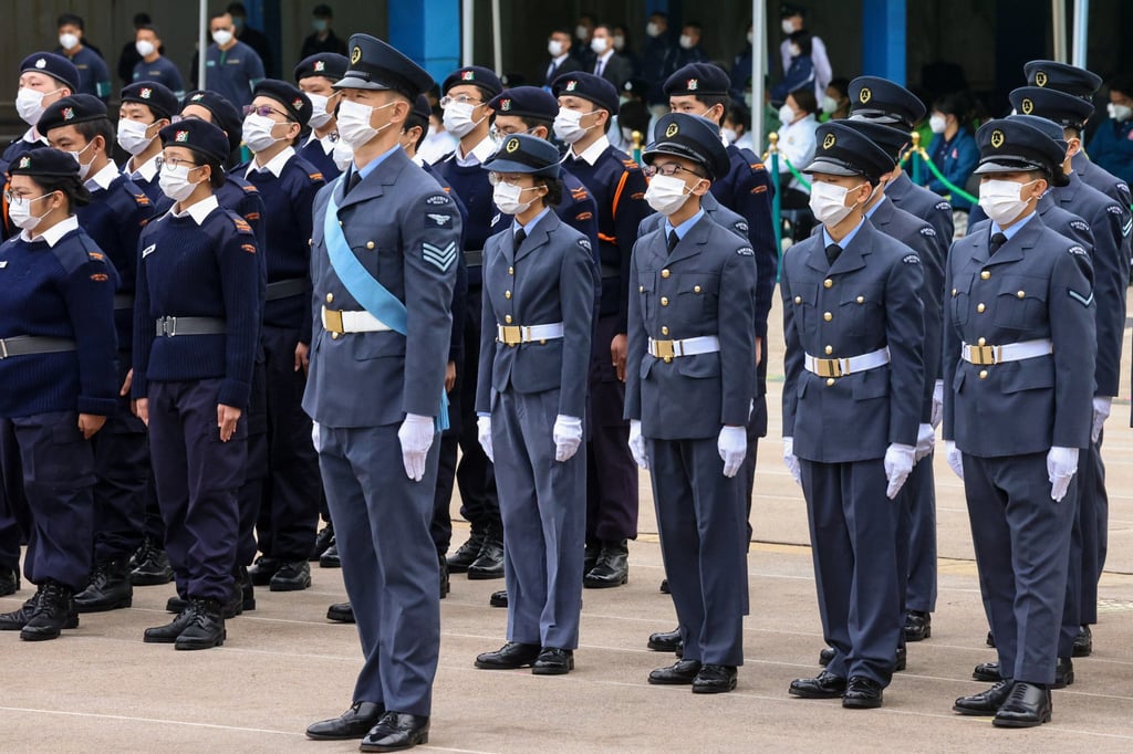 The flag-raising ceremony on Sunday was attended by officers and youth groups under six disciplined services in the city. Photo: K.Y. Cheng The flag-raising ceremony on Sunday was attended by officers and youth groups under six disciplined services in the city. Photo: K.Y. Cheng