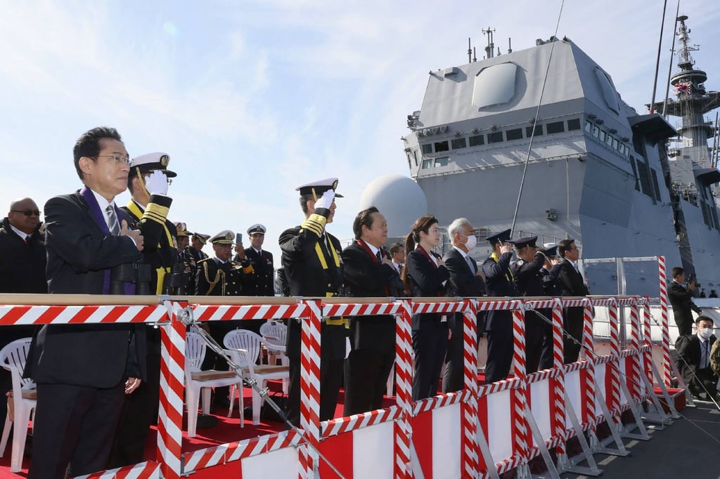 Japan’s Prime Minister Fumio Kishida (far left) looks out from the Japanese ship JS Izumo as he inspects the “International Fleet Review”, held by Japan’s Maritime Self-Defence Force with some 12 other countries, in Sagami Bay on November 6, 2022. Photo: AFP)
