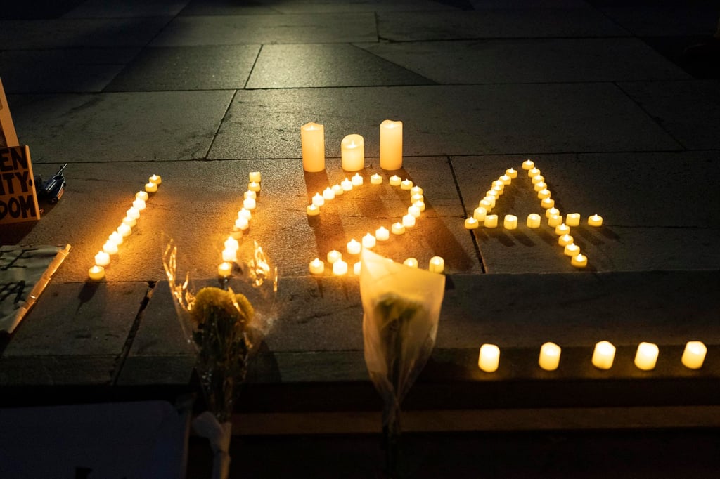 Candles, lit in remembrance of those who died in a building fire in Xinjiang are seen as demonstrators gather at Freedom Plaza in Washington on Sunday. Photo: AP Candles, lit in remembrance of those who died in a building fire in Xinjiang are seen as demonstrators gather at Freedom Plaza in Washington on Sunday. Photo: AP