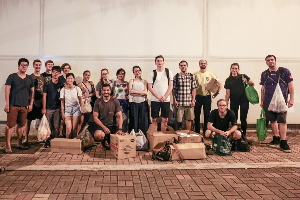 Volunteers distribute supplies on one of the Impact Hong Kong’s Kindness Walks. Photo: Handout