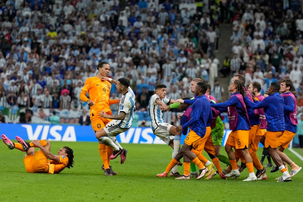 Netherlands alternate players confront Argentina’s Nahuel Molina, centre, during their Fifa World Cup quarter final match in Lusail, Qatar on Friday. Photo: AP