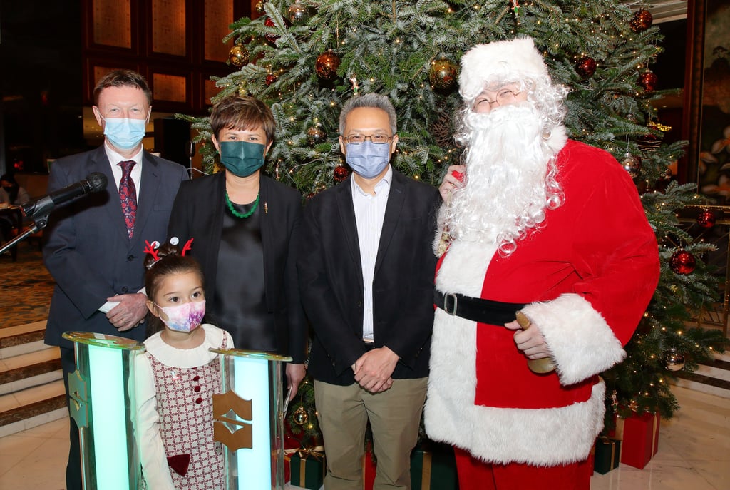 (From left) Jim Gould, head of English programme service at RTHK; Ghislaine Lê, hotel manager; and David Wong, OSC project director, with Santa Claus. Photo: Bharat Khemlani (From left) Jim Gould, head of English programme service at RTHK; Ghislaine Lê, hotel manager; and David Wong, OSC project director, with Santa Claus. Photo: Bharat Khemlani