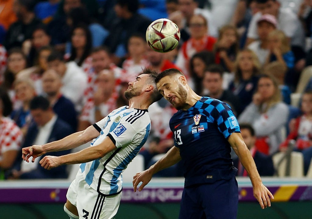 Argentina’s Nicolas Tagliafico vies for the ball with Croatia’s Nikola Vlasic at Lusail Stadium in Qatar on Tuesday. Photo: Reuters