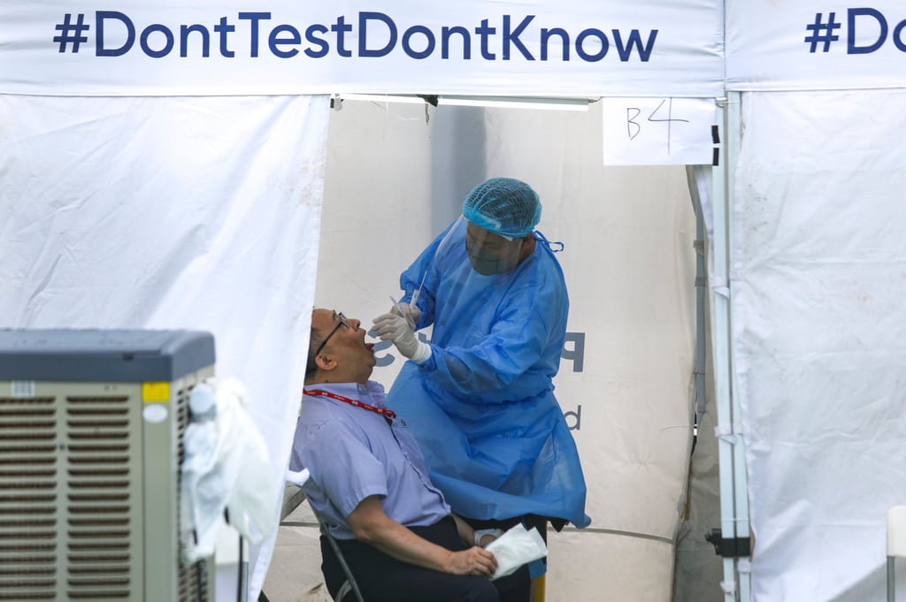 A coronavirus PCR test is carried out by health staff. Photo: Xiaomei Chen