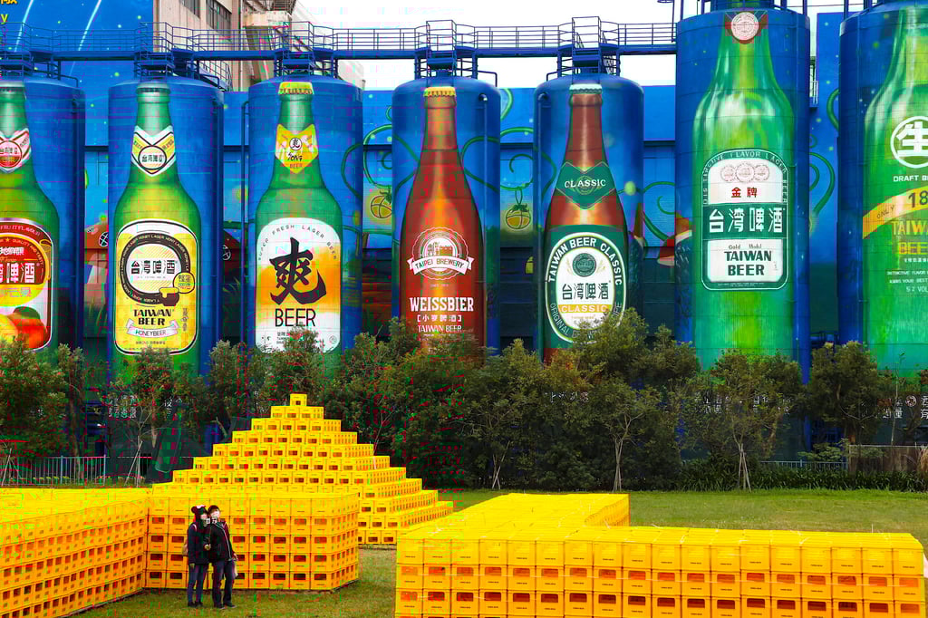 Tourists take photos at the Zhunan Brewery in Miaoli, owned by Taiwan Tobacco and Liquor Corp, whose products are among those blocked by Beijing. Photo: Reuters