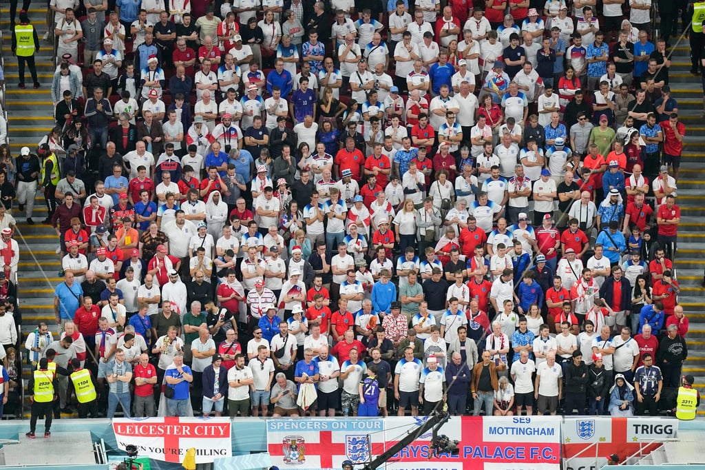 England fans watch the World Cup quarter final match between against France at the Al Bayt Stadium. Photo: AP England fans watch the World Cup quarter final match between against France at the Al Bayt Stadium. Photo: AP