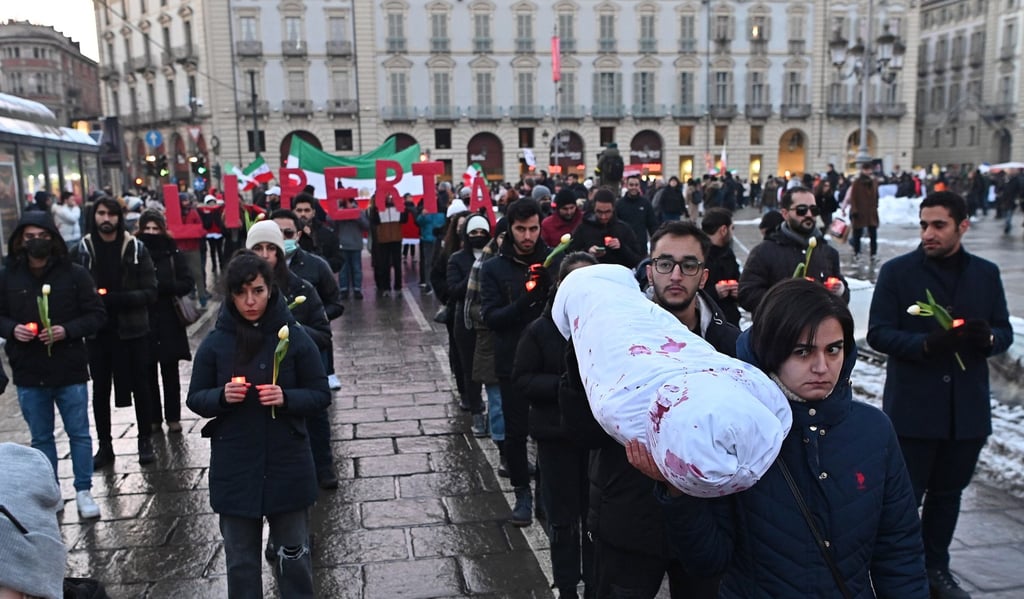 Protesters perform a mock funeral as they take part in a demonstration against Iran’s regime staged by the Iranian community in Turin, Italy on Saturday following Iran’s public execution of two young demonstrators, Mohsen Shekari and Majidreza Rahnavard. Photo: EPA-EFE Protesters perform a mock funeral as they take part in a demonstration against Iran’s regime staged by the Iranian community in Turin, Italy on Saturday following Iran’s public execution of two young demonstrators, Mohsen Shekari and Majidreza Rahnavard. Photo: EPA-EFE