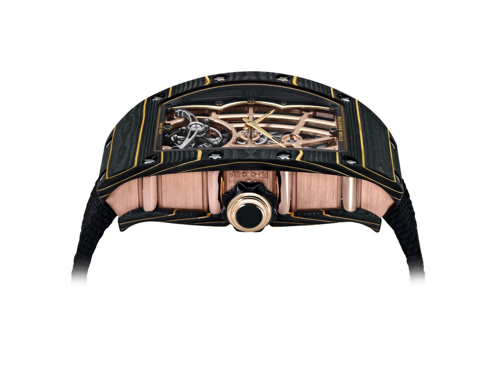 Richard Mille 74-02 features a Gold Carbon TPT made from 24-carat gold leaf with Carbon TPT. Richard Mille 74-02 features a Gold Carbon TPT made from 24-carat gold leaf with Carbon TPT.