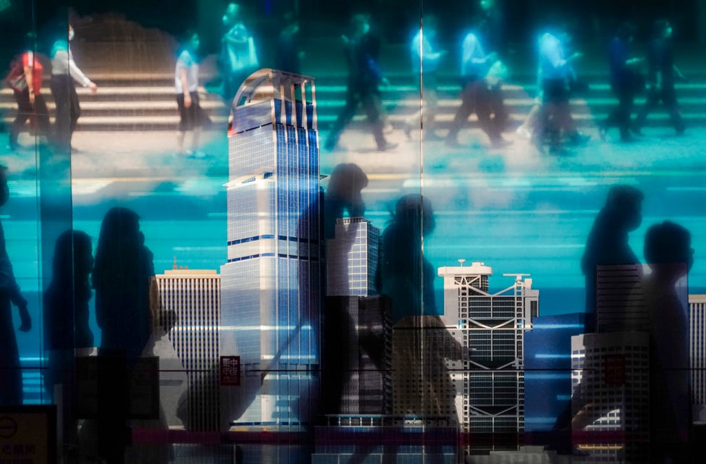 People walk past a transparent poster advertising an exhibition, in Central market on June 2, 2022. Hongkongers are facing a higher cost-of-living in many areas including higher electricity bills starting in January. Photo: Felix Wong People walk past a transparent poster advertising an exhibition, in Central market on June 2, 2022. Hongkongers are facing a higher cost-of-living in many areas including higher electricity bills starting in January. Photo: Felix Wong