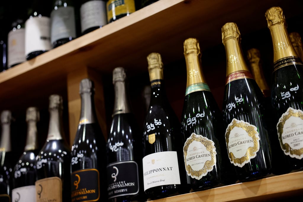 Bottles of Champagne are seen on display for sale in a wine shop in Paris, France. Photo: Reuters