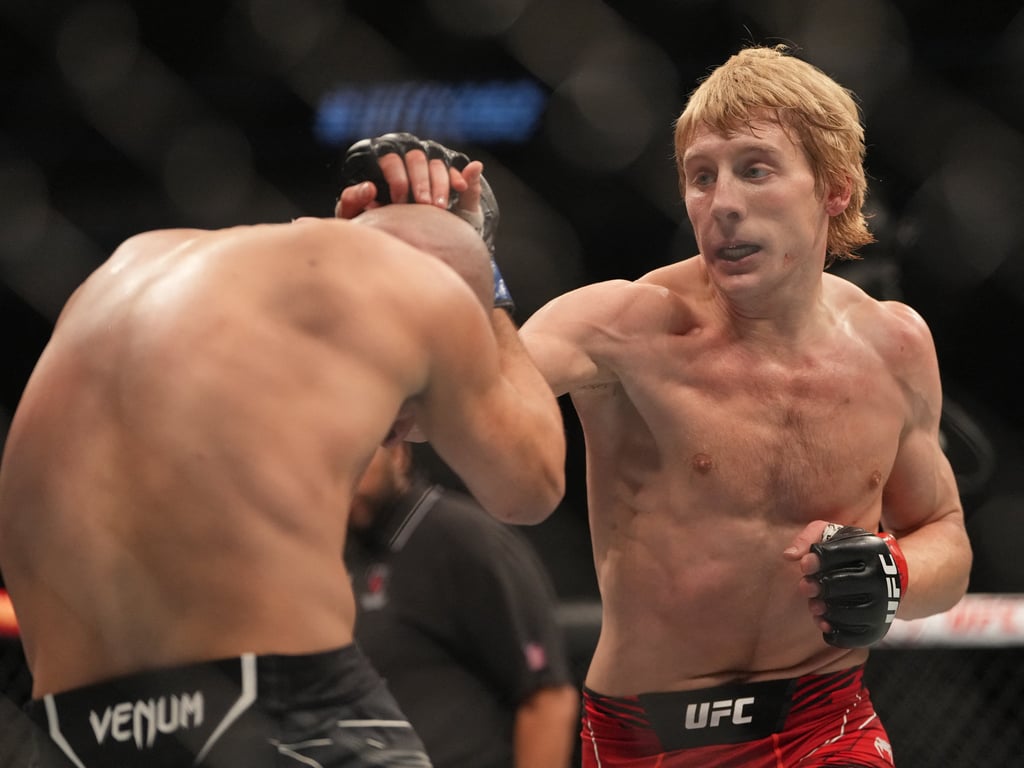 Dec 10, 2022; Las Vegas, Nevada, USA; Paddy Pimblett (red gloves) fights Jared Gordon (blue gloves) during UFC 282 at T-Mobile Arena. Mandatory Credit: Stephen R. Sylvanie-USA TODAY Sports