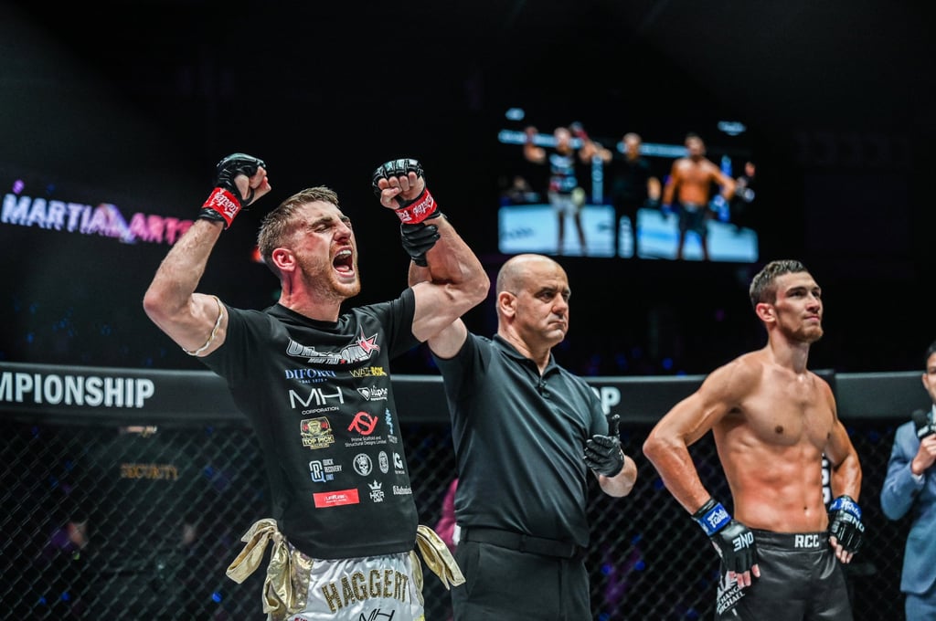 Jonathan Haggerty celebrates his decision win over Vladimir Kuzmin in Singapore. Jonathan Haggerty celebrates his decision win over Vladimir Kuzmin in Singapore.