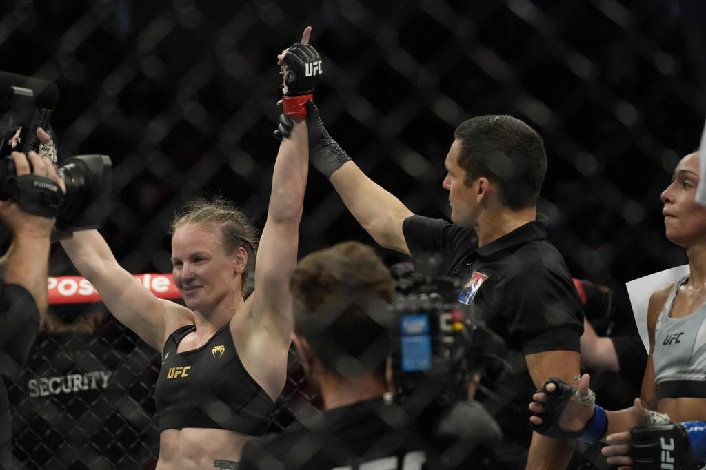 Valentina Shevchenko celebrates her win against Taila Santos in their women’s flyweight title fight at UFC 275 in Singapore. Photo: AFP