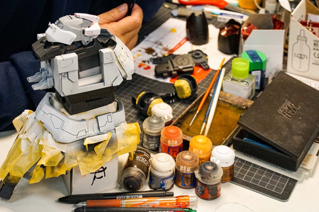 Ng working on a Gunpla. Photo: Sam Li Ng working on a Gunpla. Photo: Sam Li
