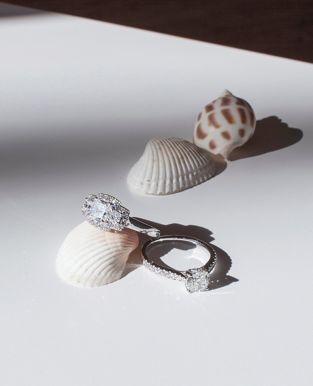 Lab-grown diamonds on engagement rings. Photo: Smiling Rocks