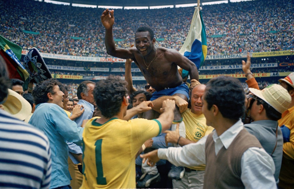 Brazil’s Pele is hoisted on the shoulders of his teammates after Brazil won the 1970 World Cup football final against Italy in Mexico. Photo: AP