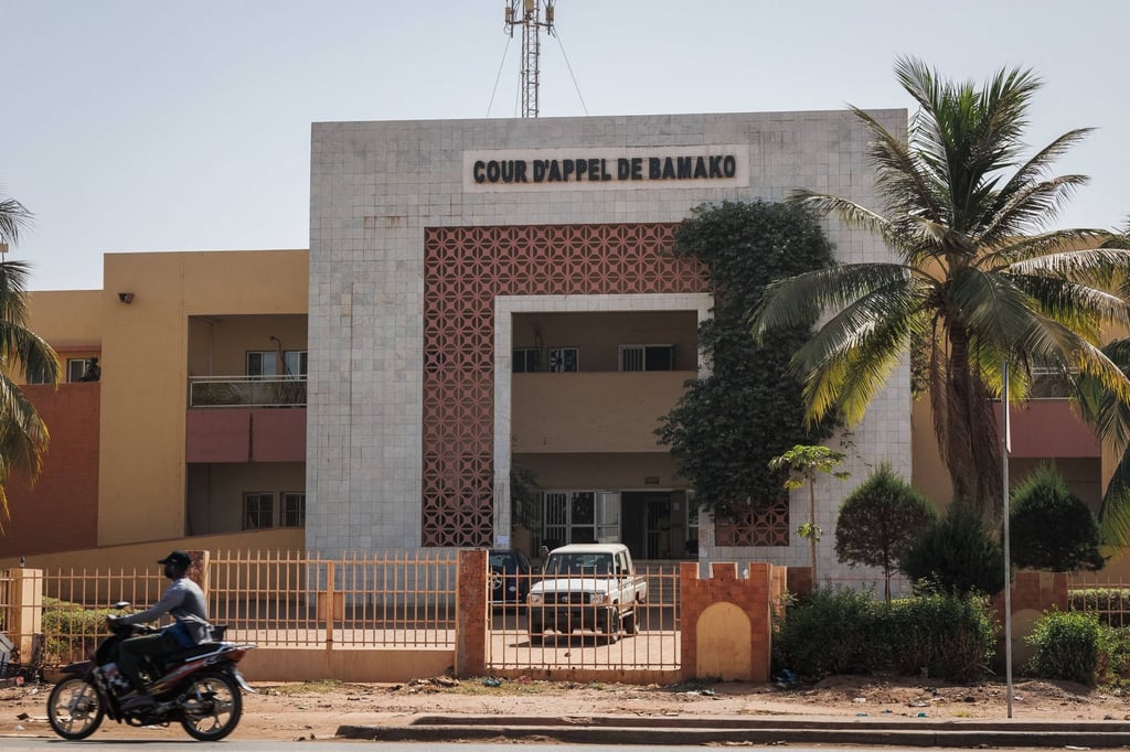 A man rides a motorbike past the Court of Appeal in Bamako, where the trial of the 46 Ivorian soldiers arrested in Mali concluded on Friday. Photo: AFP A man rides a motorbike past the Court of Appeal in Bamako, where the trial of the 46 Ivorian soldiers arrested in Mali concluded on Friday. Photo: AFP
