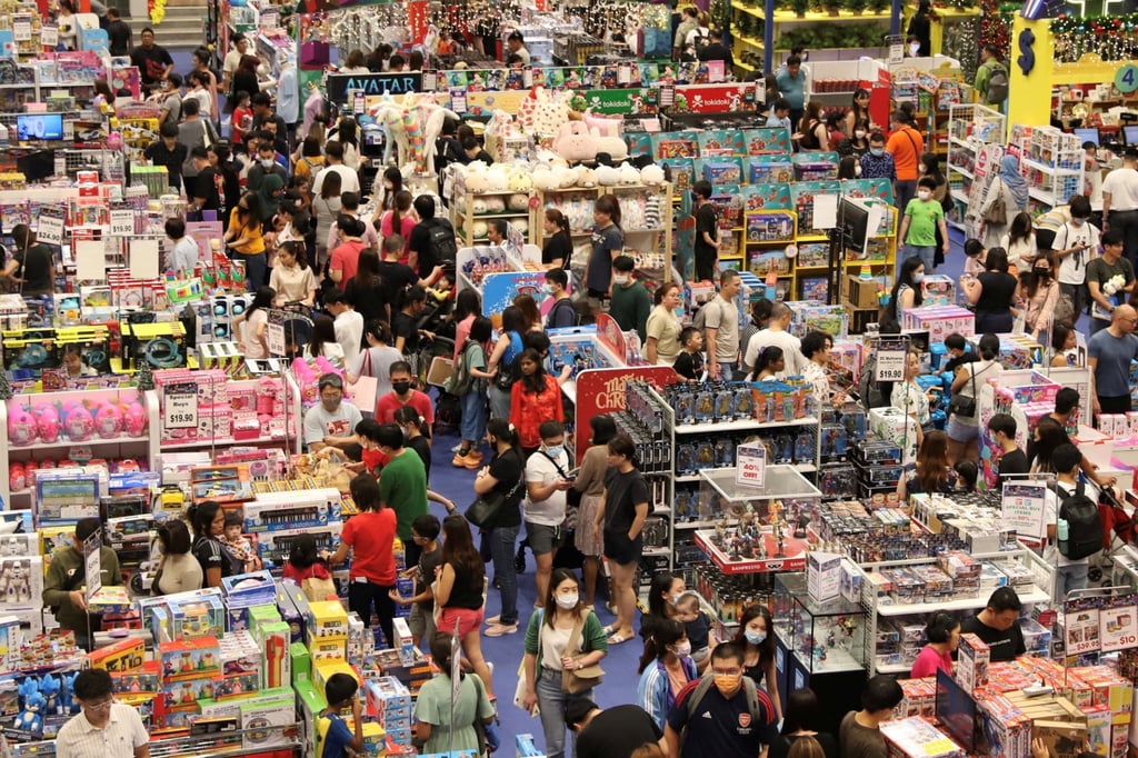 Shoppers browse merchandise in a shopping centre on Orchard Road in Singapore last month. Photo: Reuters