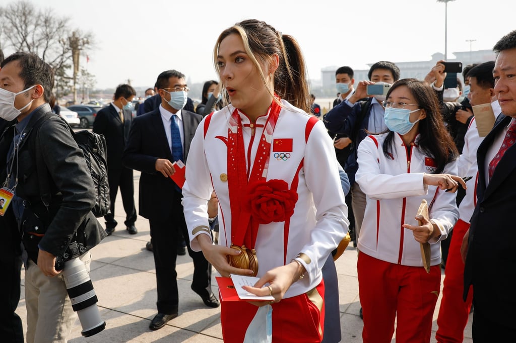 Chinese Olympian Eileen Gu reacts after being mobbed by fans and journalists during her arrival at the ceremony for China’s Beijing 2022 Winter Olympic and Paralympic Games heroes at the Great Hall of the People in Beijing. Photo: EPA-EFE Chinese Olympian Eileen Gu reacts after being mobbed by fans and journalists during her arrival at the ceremony for China’s Beijing 2022 Winter Olympic and Paralympic Games heroes at the Great Hall of the People in Beijing. Photo: EPA-EFE