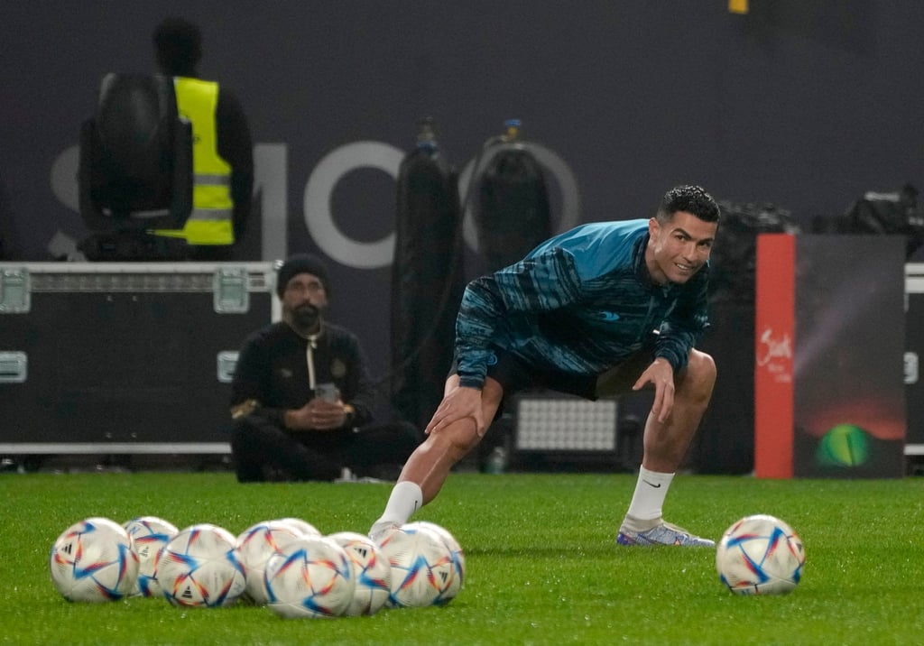 Cristiano Ronaldo warms up during his first training after the official unveiling as a new member of Al Nassr. Photo: AP