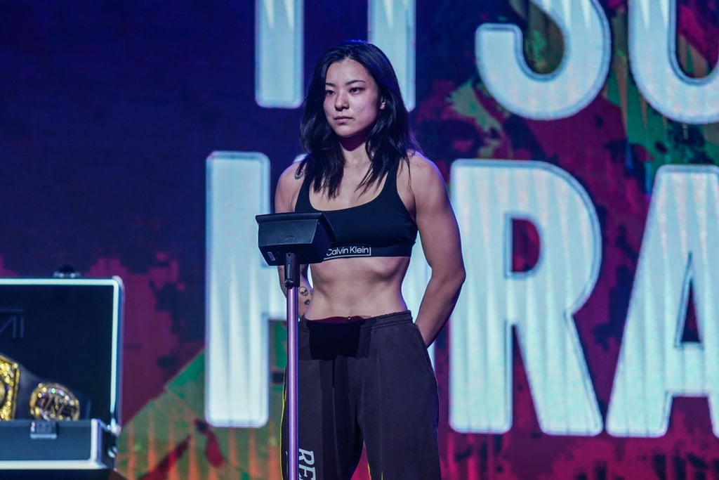 Itsuki Hirata poses on the scale at the ONE 163 ceremonial weigh-ins.