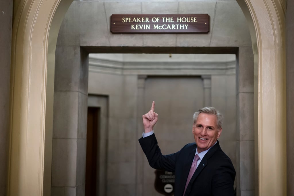 Kevin McCarthy points to the newly installed nameplate at his office after he was sworn in as speaker in Washington on Saturday. Photo: AP