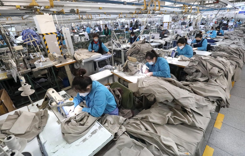 Workers are busy at the production line of an apparel company in Shijiazhuang, north China’s Hebei province. Photo: Xinhua Workers are busy at the production line of an apparel company in Shijiazhuang, north China’s Hebei province. Photo: Xinhua