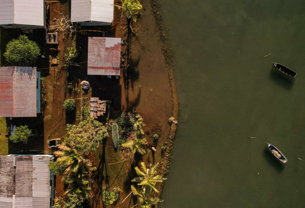 Seawater floods past an ineffective sea wall into the community of Veivatuloa Village, Fiji, July 16, 2022. Photo: Reuters