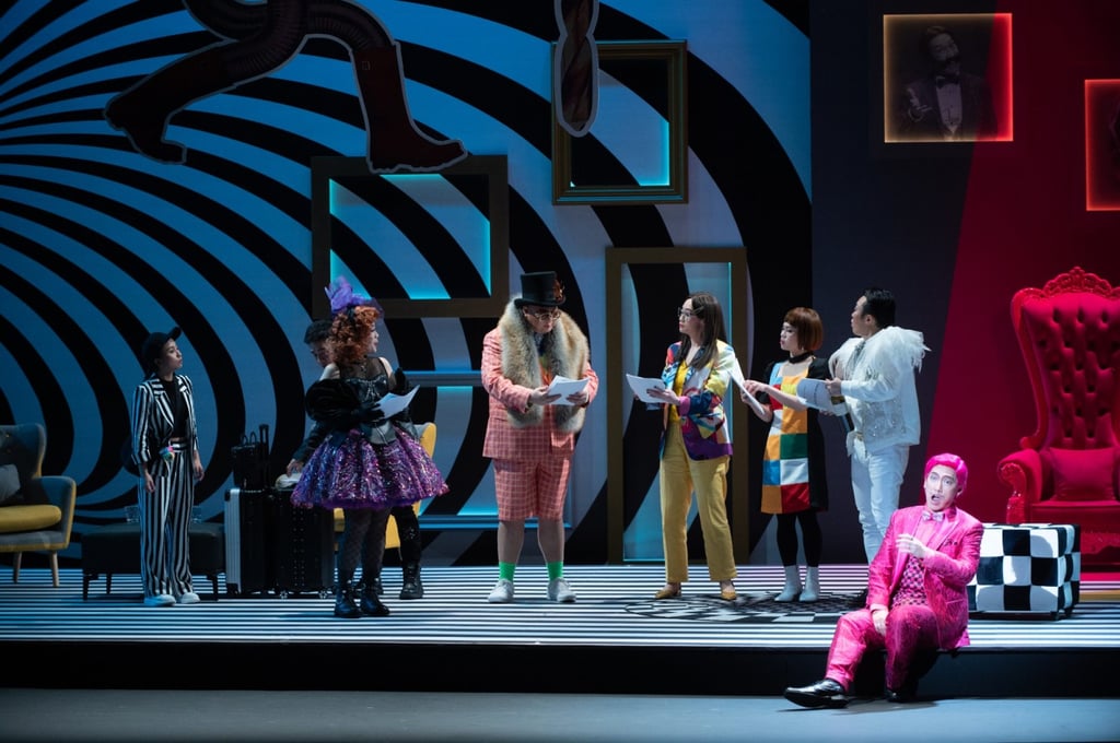 A scene from Hong Kong Grand Opera’s production of “L’impresario in Angustie”. Front: baritone Sammy Chien; back, from left to right: actress Elly Lam, countertenor Marcus Choy, soprano Kenix Tsang, baritone Caleb Woo, mezzo-soprano Samantha Chong, soprano Phoebe Tam and tenor Yong Chen. Photo: Maximillian Cheng A scene from Hong Kong Grand Opera’s production of “L’impresario in Angustie”. Front: baritone Sammy Chien; back, from left to right: actress Elly Lam, countertenor Marcus Choy, soprano Kenix Tsang, baritone Caleb Woo, mezzo-soprano Samantha Chong, soprano Phoebe Tam and tenor Yong Chen. Photo: Maximillian Cheng