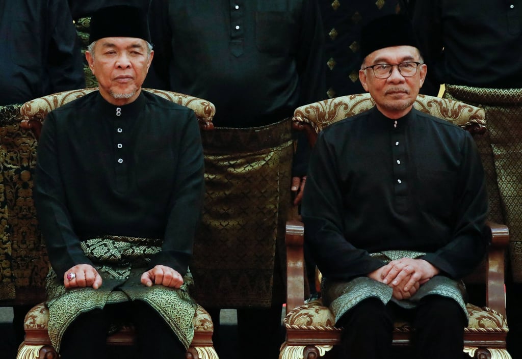 Anwar sits beside Umno President and Deputy Prime Minister Ahmad Zahid Hamidi (left) after a cabinet swearing-in ceremony last month. Photo: AFP Anwar sits beside Umno President and Deputy Prime Minister Ahmad Zahid Hamidi (left) after a cabinet swearing-in ceremony last month. Photo: AFP