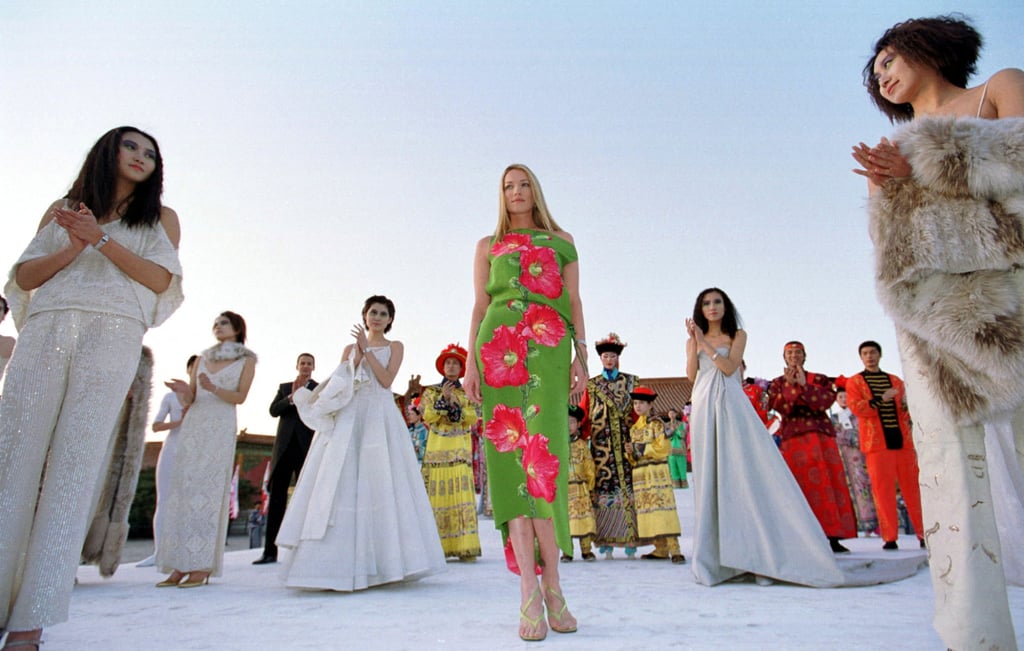 International model Tatjana Patitz, accompanied by her Chinese counterparts, performs during a fashion show at the Forbidden City to promote a Swiss watch company in April 2000. Photo: Reuters